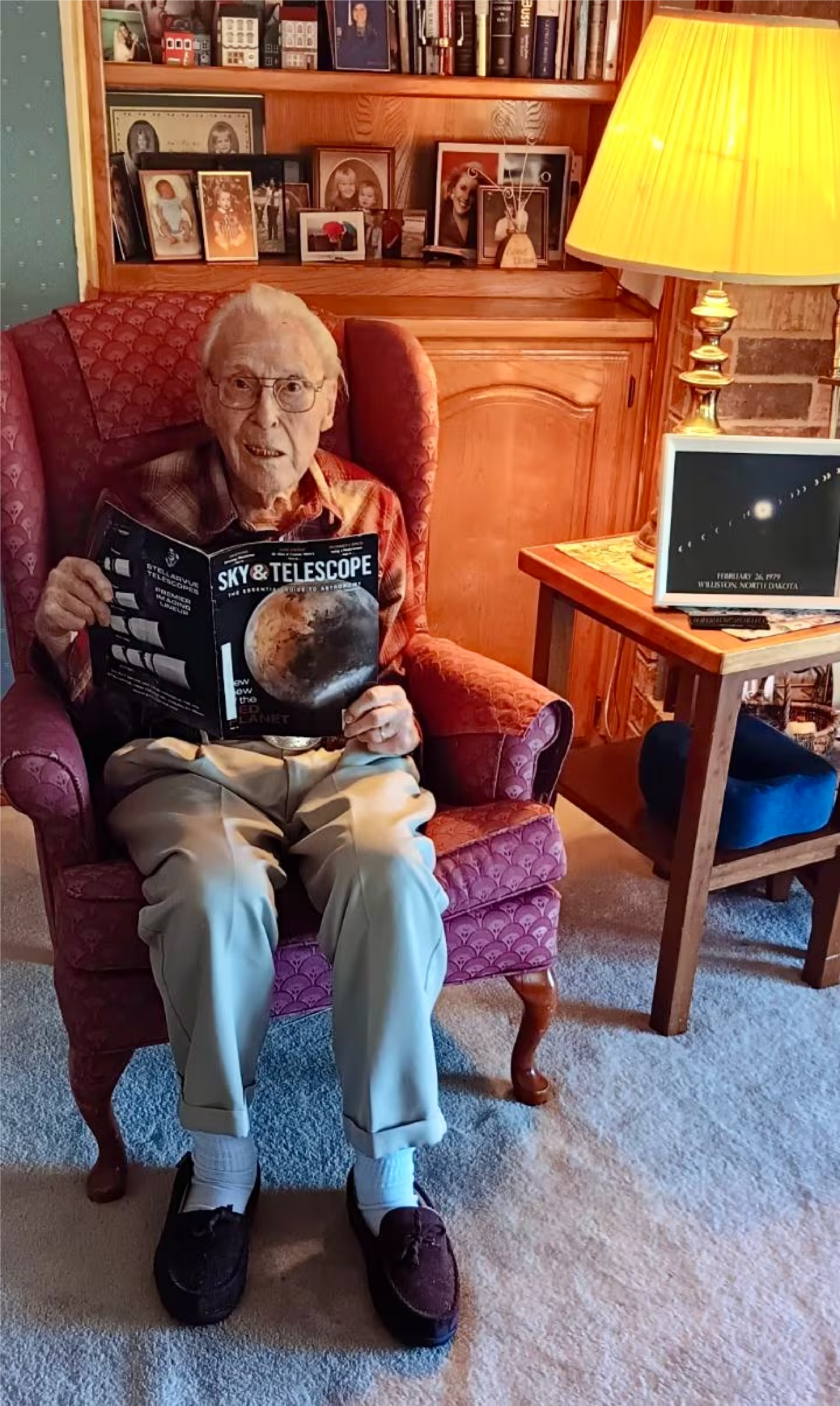 Biser reads his favorite magazine — the February 2024 issue of the Sky & Telescope magazine. (Cheryl Torres)